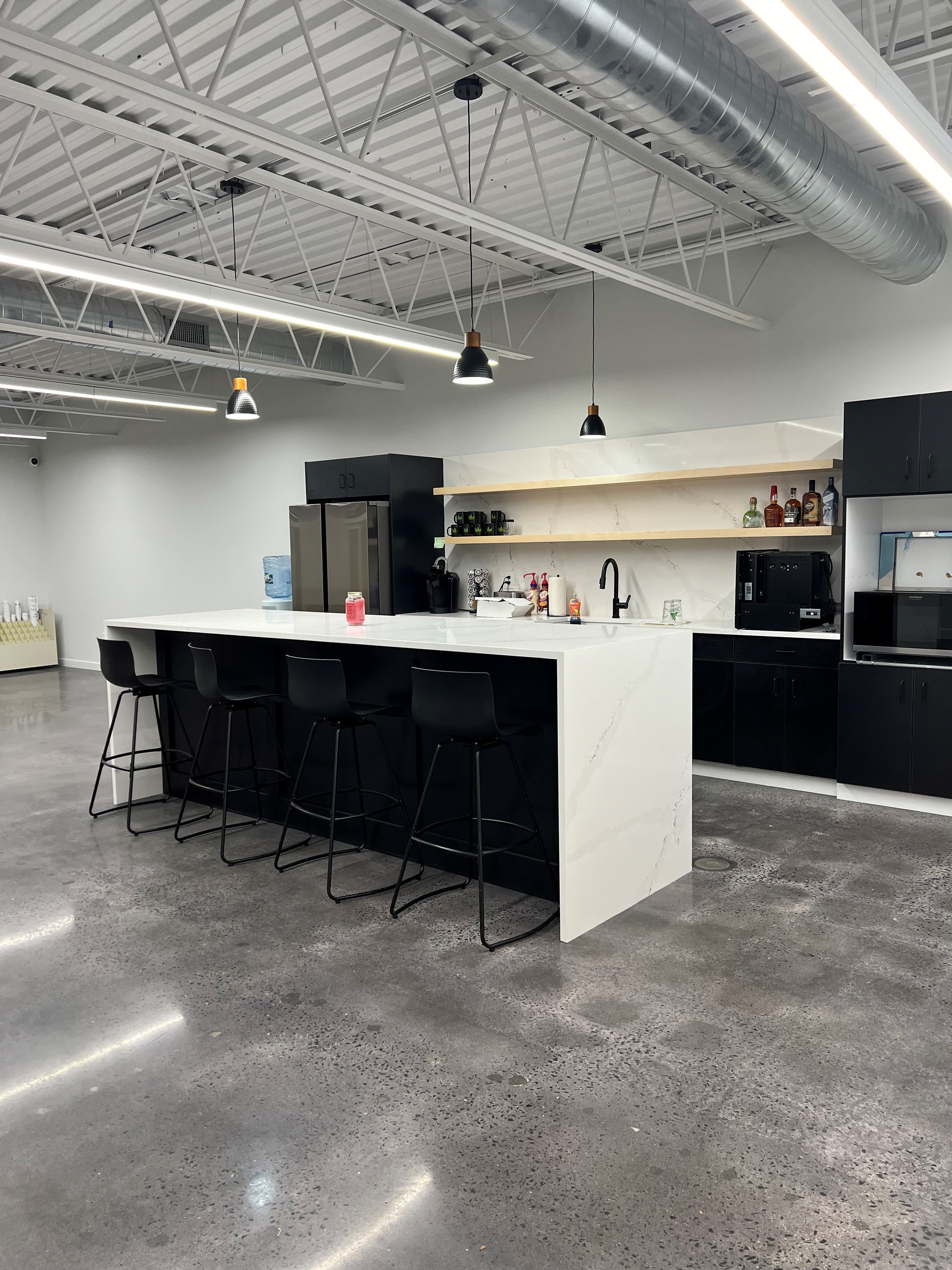 Full kitchen lighting, pendant fixtures, and electrical fit-out for a commercial office