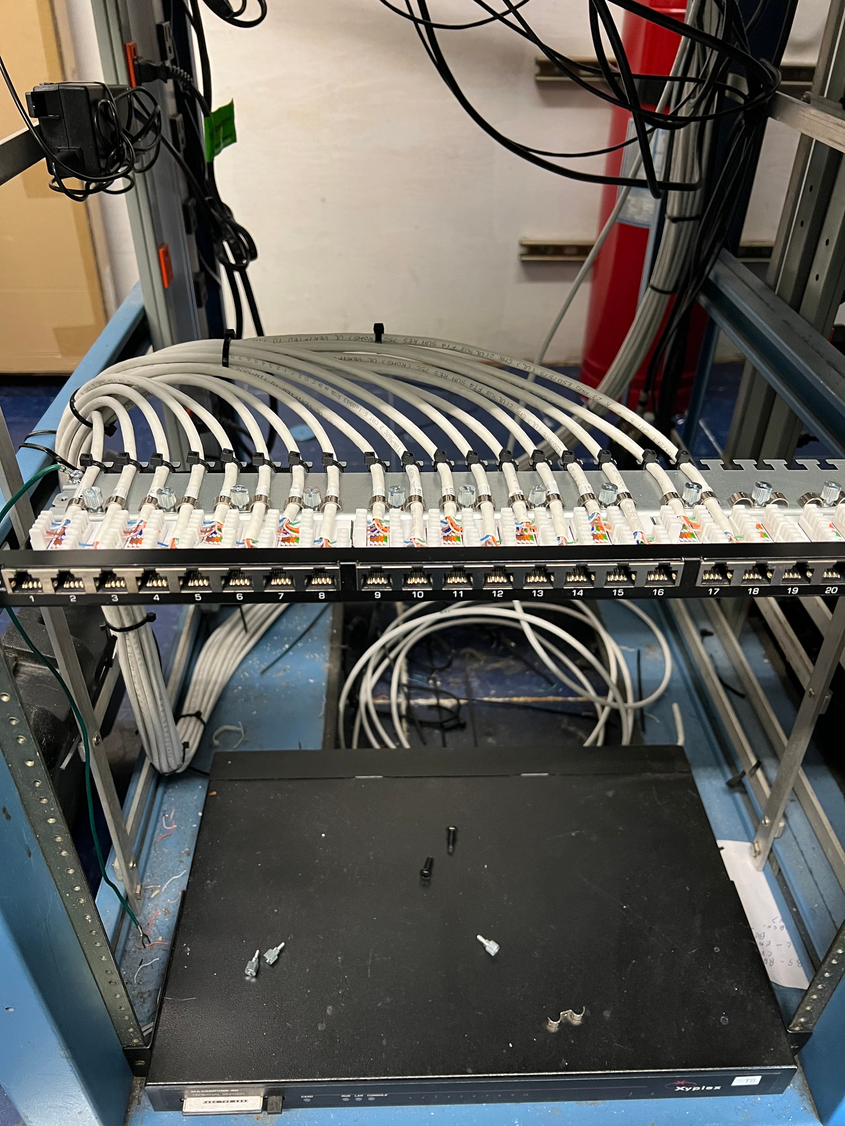 High-density patch panel termination with organized cable fan-out in a server rack
