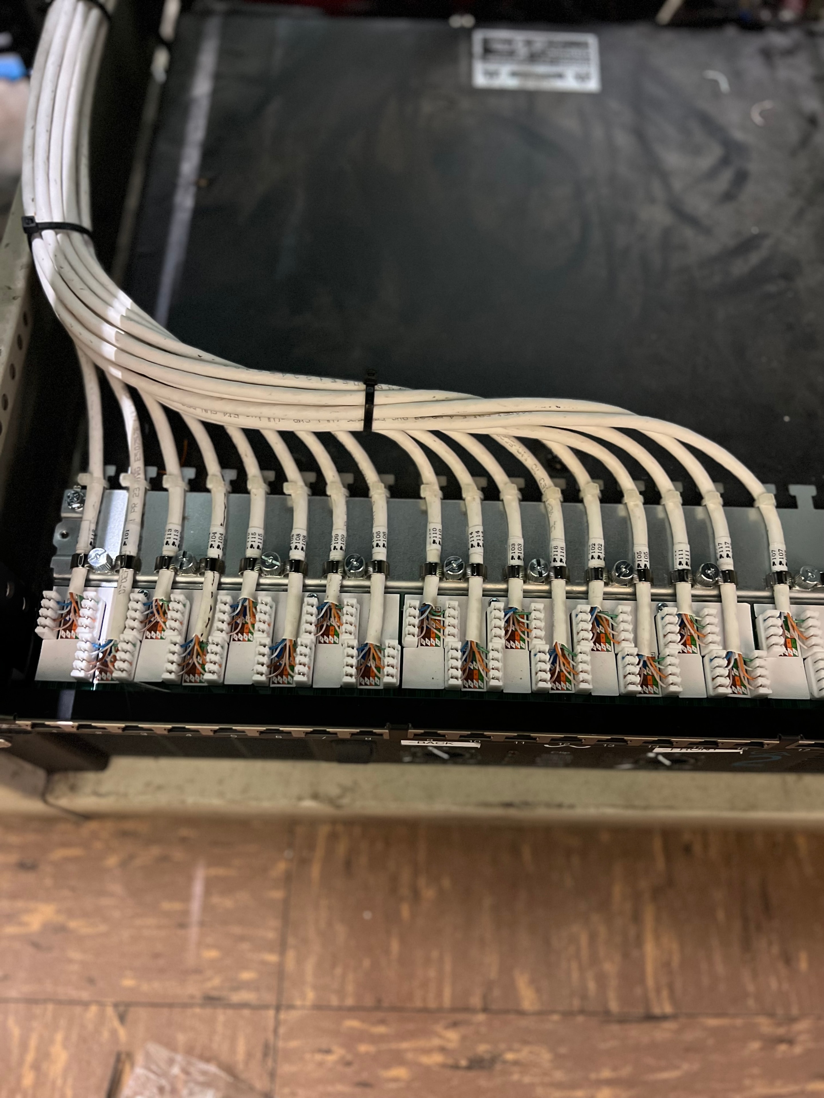 110-block punch-down termination with labeled cable runs in a rack enclosure
