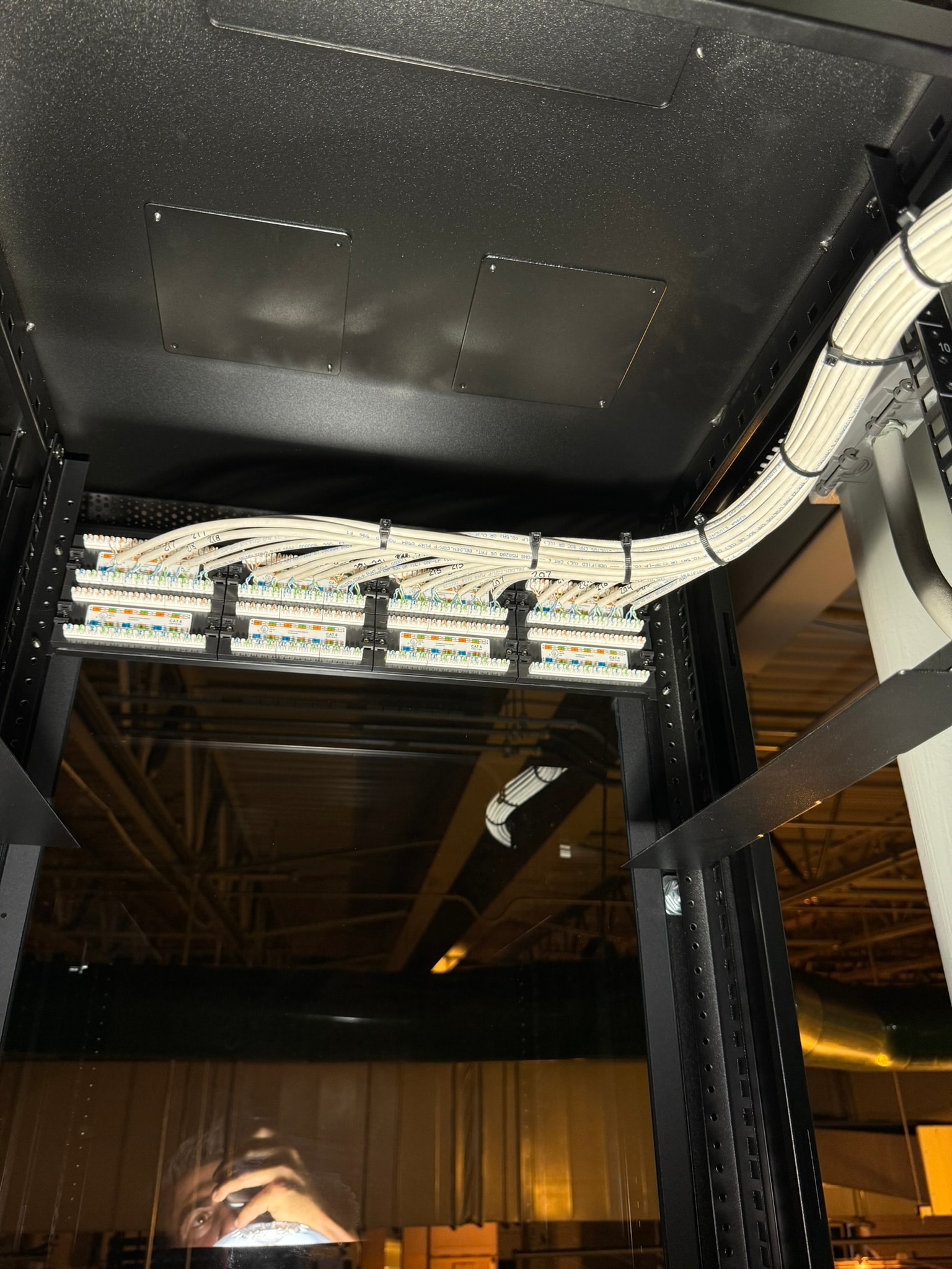Structured cabling and patch panel termination in a commercial server rack