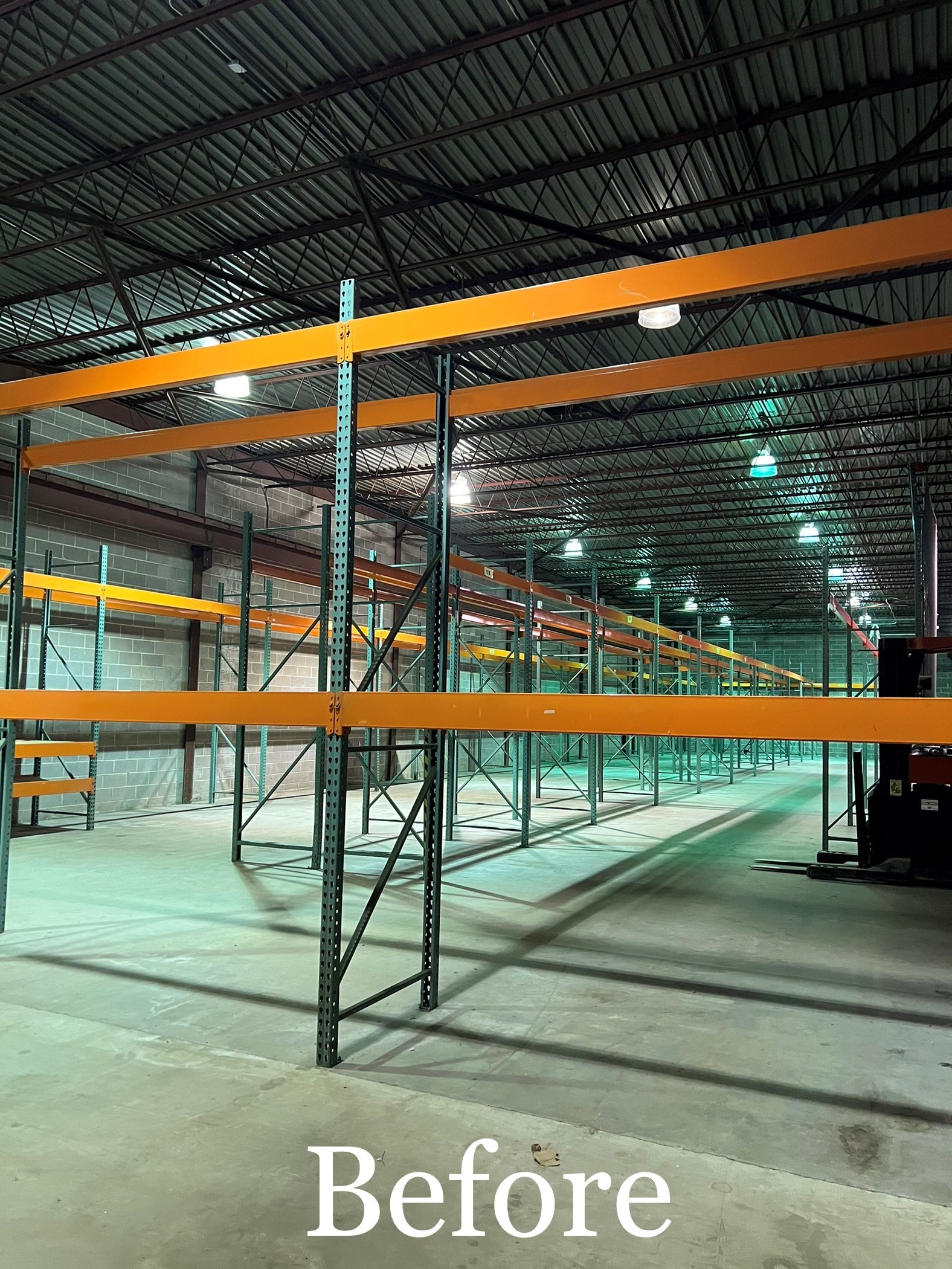 Warehouse interior with original fluorescent lighting before the LED upgrade
